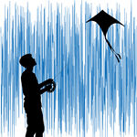 男孩在蓝天下快乐放风筝