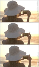 美女拿手机拍摄海洋日落