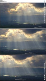 俯瞰云层阳光穿过乌云照耀山谷