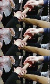 一群人手搭手鼓励