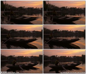 日落时分一对夫妇在越南老式渔船