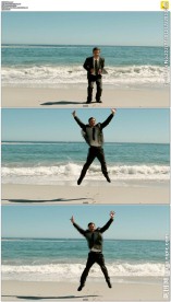 商人海边欢呼跳跃