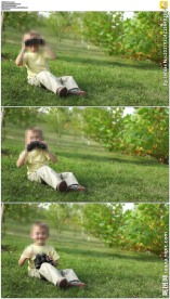 草地小男孩使用望远镜