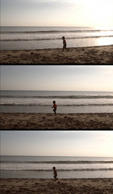 小孩在海边奔跑实拍视频