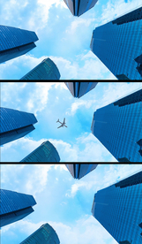 4K飞机飞过高楼大厦背景视频